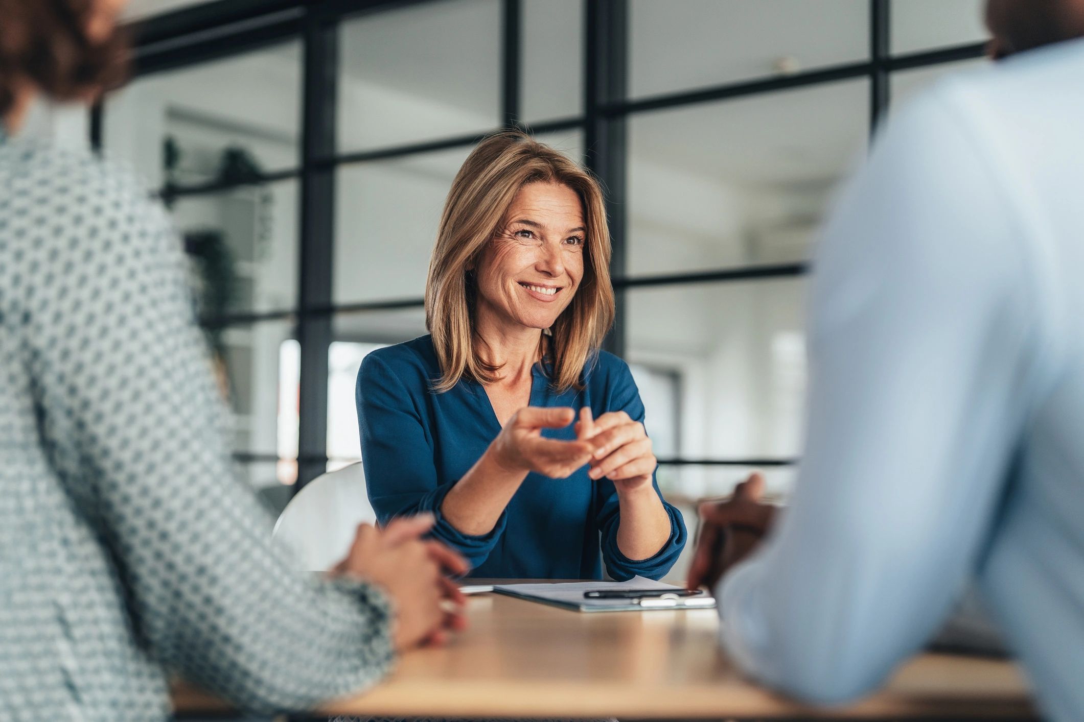 happy real estate agent with clients